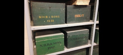 These wooden boxes at NH Bragg’s headquarters contain financial records from the company’s early years in the 1800s. (ID Photo)