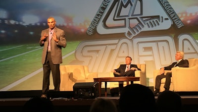 Former NFL head coach and current ESPN analyst Herm Edwards delivers his keynote speech during STAFDA's General Session. (ID photo)