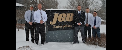 From Left: JGB Executive VP Steve Starrantino, President Bob Zywicki, CFO Matt DeKay, Purchasing Manager Ryan Thurston and National Inside Sales Manager Pete Delvecchio brave a major March snowstorm aside the company's headquarters sign in Liverpool, NY