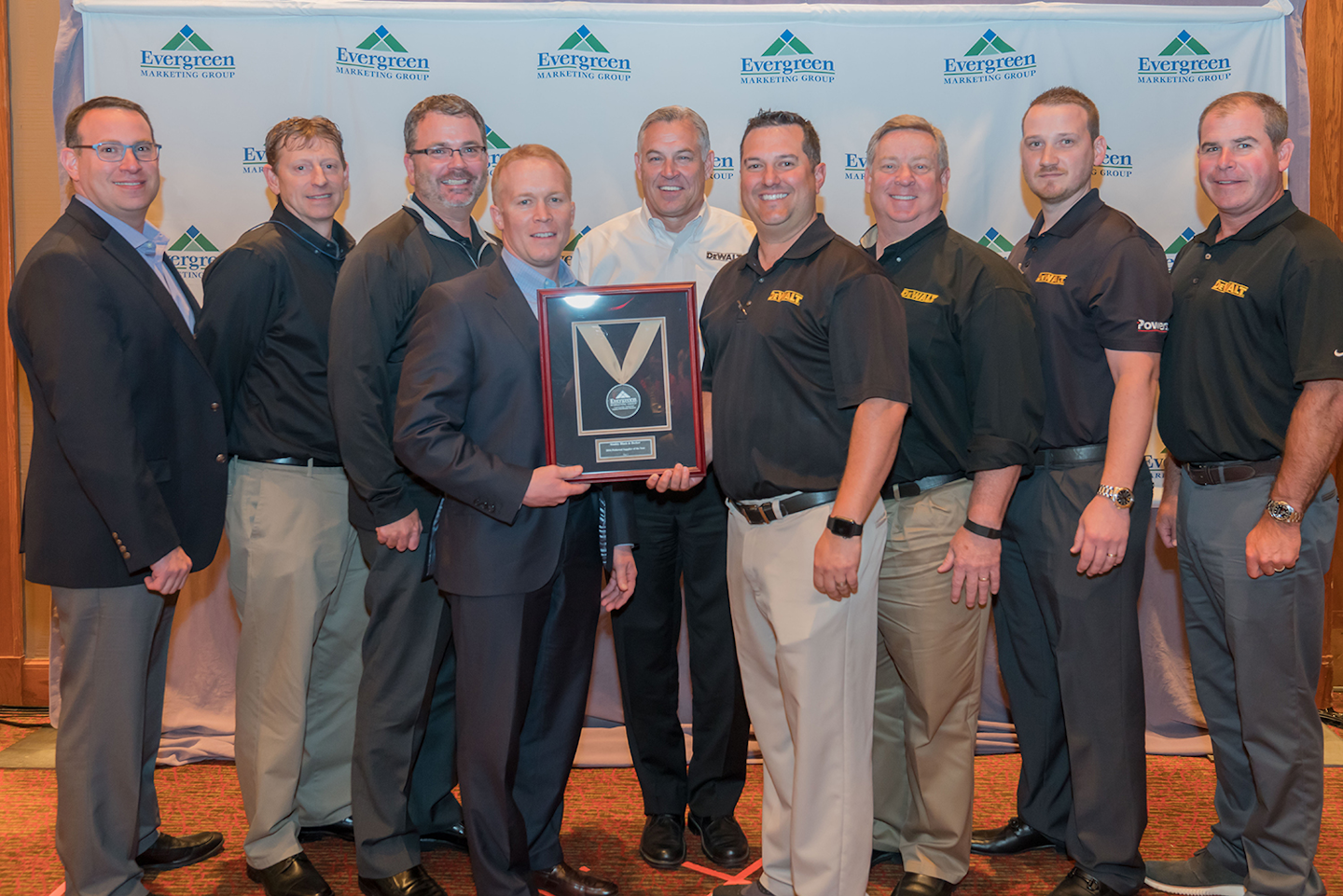DeWalt Tools members accept Evergreen Marketing's Tier 1 Preferred Supplier of the Year Award at Evergreen's 28th Partnership Conference in Dallas, TX in April.