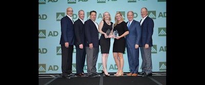 Members of Industrial Supply Company and Kimberly Clark accept AD Industrial's award for Best Conversion for Safety.