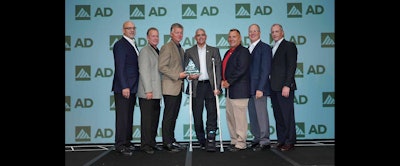 Members of Tingley Rubber accept AD Industrial's asward for Tier 1 Supplier of the Year.