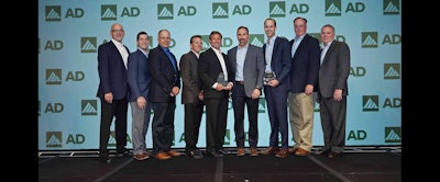 Members of Milwaukee Tool and Black & Company accept AD Industrial's award for 2017 Best AD Conversion for Tools & Material Handling.