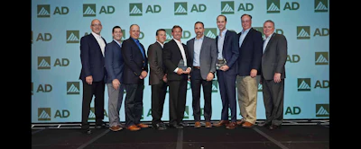 Members of Milwaukee Tool and Black & Company accept AD Industrial's award for 2017 Best AD Conversion for Tools & Material Handling.