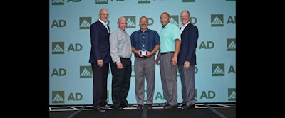 Members of Quality Mill accept AD Industrial's award for Best Annual Process.