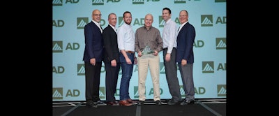 Members of P&I Supply accept AD Industrial's award for Tier 2 Member of the Year.
