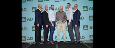 Members of P&I Supply accept AD Industrial's award for Tier 2 Member of the Year.