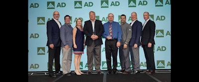 Jeff and Kevin Ketter of T&A Industrial accept AD Industrial's MVPs award.
