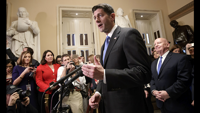 Speaker of the House Paul Ryan, joined at right by House Ways and Means Committee Chairman Kevin Brady, meets reporters just after passing the Republican tax reform bill in the House of Representatives, on Capitol Hill in Washington on Tuesday (AP Photo)