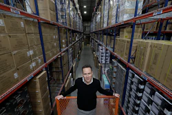 Jon Abt poses in the warehouse of the Abt family's single appliance and furniture store in Glenview, IL. He says Abt Electronics held its own this holiday season, up against competition like Amazon, Walmart, Best Buy and more (AP photo)