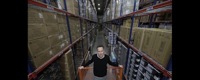 Jon Abt poses in the warehouse of the Abt family's single appliance and furniture store in Glenview, IL. He says Abt Electronics held its own this holiday season, up against competition like Amazon, Walmart, Best Buy and more (AP photo)