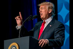 Dozens of companies have announced they are giving their employees bonuses, following the passage of the Republican tax plan that Trump signed into law in December. (AP photo)