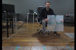 Scanalytics co-founder and CEO Joe Scanlin holds a smart floor sensor his company creates that track people's movements in Milwaukee. The sensors are among the tools retailers are using to gain insights on consumer habits. (AP photo)