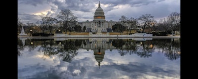 Clouds are reflected in the U.S. Capitol reflecting pool at daybreak in Washington as Day Three of the government shutdown continues on Monday. (AP Photo)