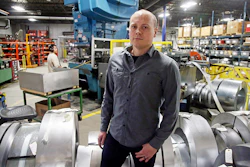 Andrew Tjernlund, a co-owner of Tjernlund Products, a manufacturer of fans and ventilation equipment, poses for a photo at his business Wednesday in White Bear Lake, MN (AP)