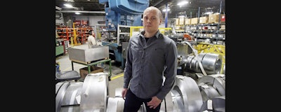 Andrew Tjernlund, a co-owner of Tjernlund Products, a manufacturer of fans and ventilation equipment, poses for a photo at his business Wednesday in White Bear Lake, MN (AP)