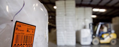 A bale of cotton sits packed and labeled while waiting to be shipped from the South Central Georgia Gin Company in Enigma, Ga.