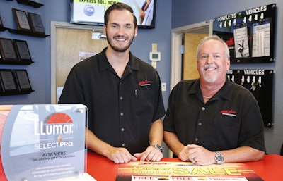 Greg Goodman, right, and his son Chandler Goodman, center, pose for a photo at the counter in their Alta Mere franchise in Oklahoma City. (AP)