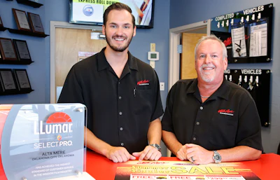 Greg Goodman, right, and his son Chandler Goodman, center, pose for a photo at the counter in their Alta Mere franchise in Oklahoma City. (AP)