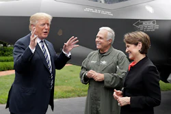 President Donald Trump talks with Lockheed Martin president and CEO Marilyn Hewson and director and chief test pilot Alan Norman in front of a F-35 as he participates in a 'Made in America Product Showcase' at the White House Monday. (AP)