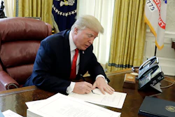 In this Dec. 22, 2017 photo, President Donald Trump signs into law a $1.5 trillion tax overhaul package in the Oval Office of the White House. (AP)