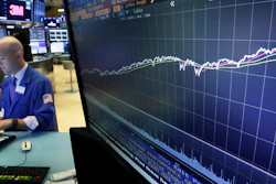 This Wednesday, Aug. 22 photo a chart on a screen on the floor of the New York Stock Exchange shows the rise of the S&P 500 index since 2009. (AP)