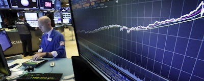 This Wednesday, Aug. 22 photo a chart on a screen on the floor of the New York Stock Exchange shows the rise of the S&P 500 index since 2009. (AP)