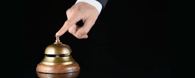 Id 35557 Hand Ringing In Service Bell On Wooden Table On Black Background Hjxb8vkfz F0000