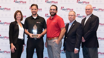 Members of Northern Safety & Industrial posing with NetPlus Alliance executives after accepting NetPlus' Distributor of the Year Award.