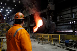 In this June 28, 2018 file photo, senior melt operator Randy Feltmeyer watches a giant ladle as it backs away after pouring its contents of red-hot iron into a vessel in the basic oxygen furnace as part of the process of producing steel at the U.S. Steel Granite City Works facility in Granite City, IL.
