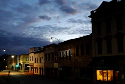 In this Oct. 28, 2017 file photo, the storefront window of a portrait studio is lit up along a downtown street at dusk in Lumberton, N.C. With a little over one month to go in 2019, small business owners should think about purchases or investments that make good business sense and will give them a break on their taxes.