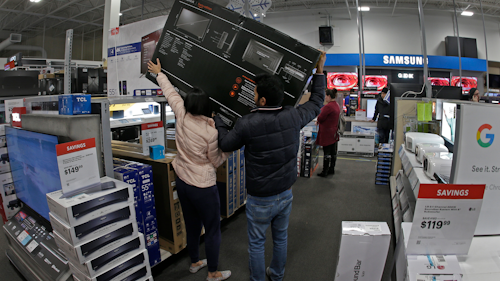 In this Nov. 28, file photo, people shop at a Best Buy store during a Black Friday sale in Overland Park, KS.