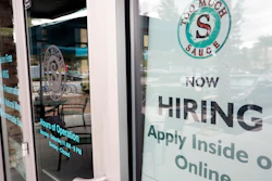 In this Nov. 4, 2019 file photo, a job posting is displayed near the entrance outside a restaurant in Orlando, FL.