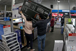 In this Nov. 28, file photo, people shop at a Best Buy store during a Black Friday sale in Overland Park, KS.