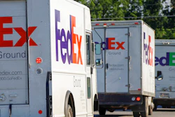 In this June 26, 2019, file photo delivery vehicles depart the FedEx Ship Center in Cranberry Township, Pa. FedEx reports earnings Tuesday, Dec. 17.