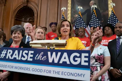 In this July 18, 2019 file photo, speaker of the House Nancy Pelosi joins fellow Democrats and activists seeking better pay as the House approved legislation to raise the federal minimum wage for the first time in a decade — to $15 an hour, at the Capitol in Washington.