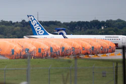 In this Oct. 3, 2019 file photo, completed Boeing 737 MAX fuselages, made at Spirit Aerosystems in Wichita, KS, sit covered in tarps near the factory.