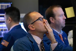 In this Jan. 2, 2020 file photo, traders monitor stock prices at the New York Stock Exchange.