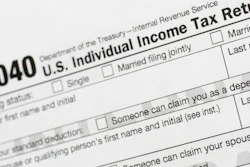 This July 24, 2018, file photo shows a portion of the 1040 U.S. Individual Income Tax Return form.