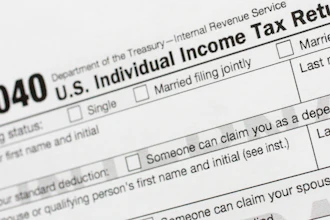 This July 24, 2018, file photo shows a portion of the 1040 U.S. Individual Income Tax Return form.