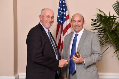 Douglas York, President and CEO of Ewing Irrigation & Landscape Supply (right), receives the chairman’s gavel from NAW 2019 Board Chairman George Pattee, Chairman of the Board of Parksite Inc., to become NAW 2020 Chairman of the Board.