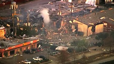 This aerial photo taken from video provided by KTRK-TV shows damage to buildings after an explosion in Houston on Jan. 24. A large explosion left rubble scattered in the area, damaged nearby homes and was felt for miles away. A fire continues to burn and people have been told to avoid the area.