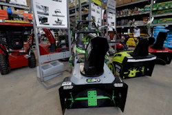 In this Jan. 27, 2020 photo, snow blowers are lined up at a Home Depot store location in Boston.