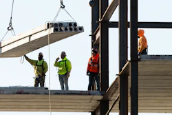 In this Dec. 3, 2019 file photo, workers erect a building under construction in Philadelphia. Spending on US construction projects edged down a slight 0.2% in December 2019, closing out a year when total construction registered its first annual decline in eight years.
