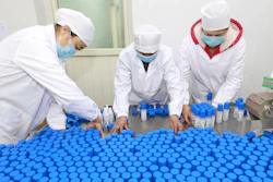Workers pack bottles of alcohol disinfectant in a factory in Suining in southwest China's Sichuan province on Tuesday, Feb. 11. China's daily death toll from a new virus topped 100 for the first time and pushed the total past 1,000 dead, authorities said Tuesday after leader Xi Jinping visited a health center to rally public morale amid little sign the contagion is abating.