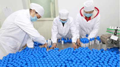 Workers pack bottles of alcohol disinfectant in a factory in Suining in southwest China's Sichuan province on Tuesday, Feb. 11. China's daily death toll from a new virus topped 100 for the first time and pushed the total past 1,000 dead, authorities said Tuesday after leader Xi Jinping visited a health center to rally public morale amid little sign the contagion is abating.