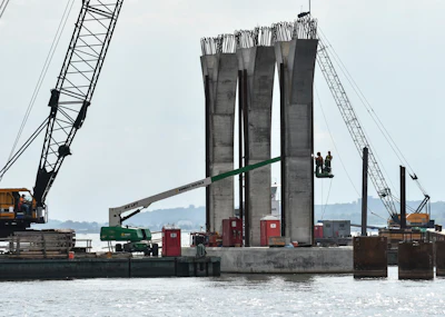 In this Aug. 28, 2018 file photo, welders work on Iowa-side columns for the new Interstate 74 bridge in Bettendorf, IA.