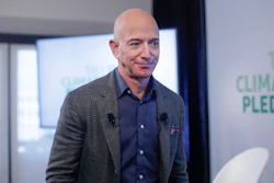 In this Thursday, Sept. 19, 2019 file photo, Amazon CEO Jeff Bezos walks off stage after holding a news conference at the National Press Club in Washington to announce the Climate Pledge, setting a goal to meet the Paris Agreement 10 years early.