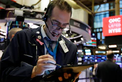 Trader Gregory Rowe works on the floor of the New York Stock Exchange on Monday, Feb. 24.