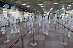 South Korean army soldiers wearing protective suits spray disinfectant to prevent the spread of the new coronavirus at Daegu International Airport in Daegu, South Korea on Friday, March 6.